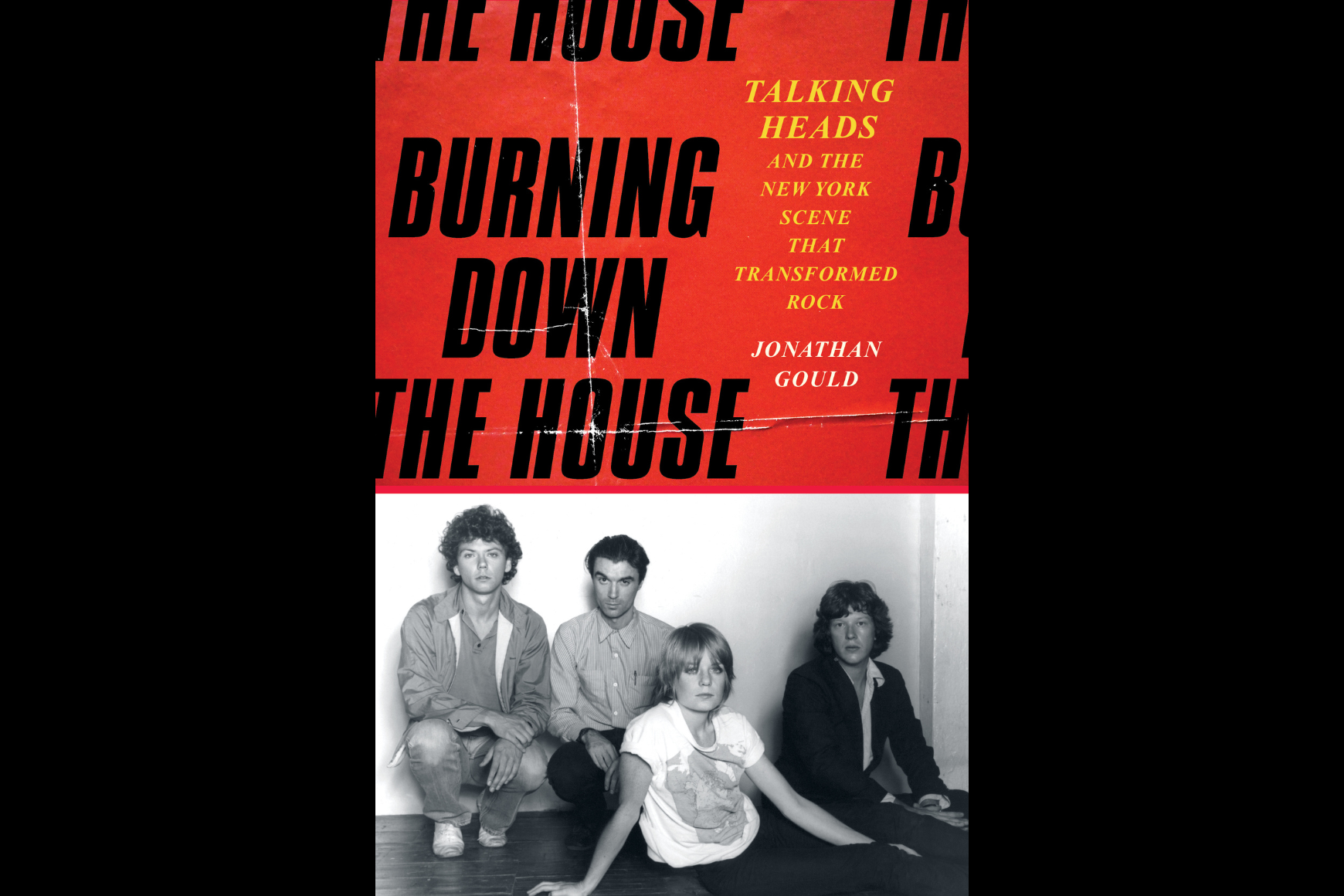 cover of book with four people sitting on the floor and black lettering on a red background above them